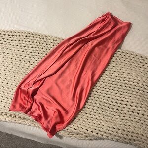 Pink satin midi skirt.